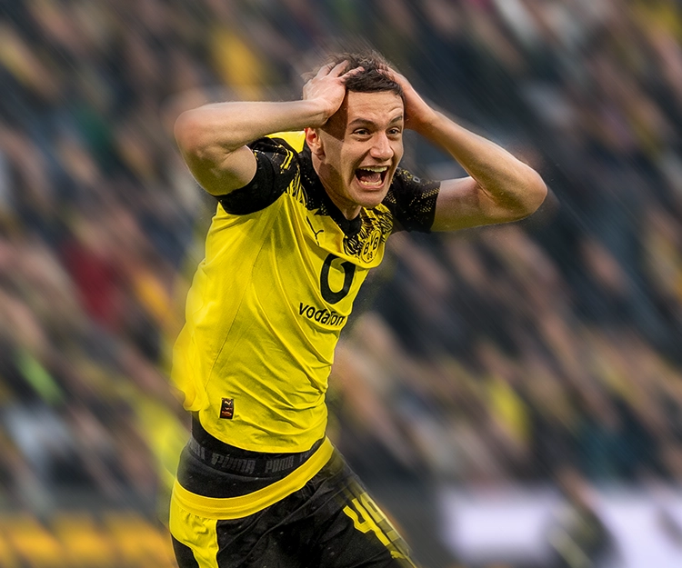 Reggiani grabbing his head in disbelief after his goal (photo)