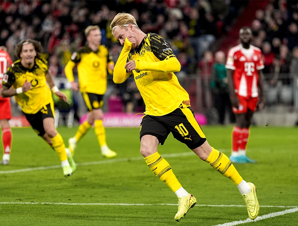 Julian Brandt wheeling away in celebration after pulling a goal back (photo)